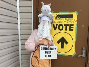 A voter in disguise prepares to enter a polling station in a photo from a Facebook page called "Any Mummers 'Lowed to Vote." The photo was posted by Crystal Martin.