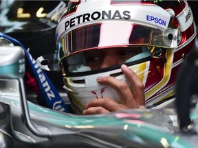 Mercedes AMG Petronas British driver Lewis Hamilton is pictured in the pits during the first practice of the F1 Mexico Grand Prix at the Hermanos Rodriguez racetrack in Mexico City on October 30, 2015.