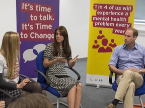 Britain's Prince William, Duke of Cambridge and Catherine, Duchess of Cambridge talk during an event in London to mark World Mental Health Day on October 10, 2015. The Duke and Duchess were meeting young people who were battling metal illness and to raise awareness of mental health.