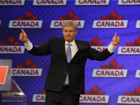 Stephen Harper gives thumbs-up while speaking to supporters after conceding defeat to the Liberals on election night in Calgary, Canada, October 19, 2015.