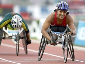 Canada's Chantal Petitclerc smiles after winning the gold medal in the Women's 800 meters wheelchair race ahead of Australia's Eliza Stankovic at the Melbourne Cricket Ground during the Commonwealth Games in Melbourne, Australia Friday March 24, 2006. Decorated wheelchair racer Petitclerc headlines the Canadian Paralympic Hall of Fame class of 2015.