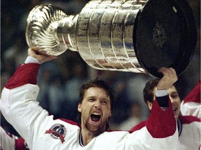 Patrick Roy hoists the Stanley Cup after beating the Los Angeles Kings in the 1993 final at the Forum in Montreal. The Canadiens, who have 24 championships, haven't won another Cup since.