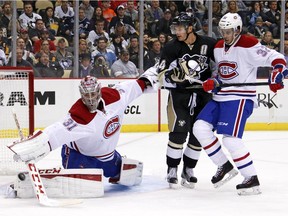 Canadiens goalie Carey Price blocks a shot with Brian Flynn defending Penguins' Chris Kunitz during the second period in Pittsburgh on Tuesday, Oct. 13, 2015.