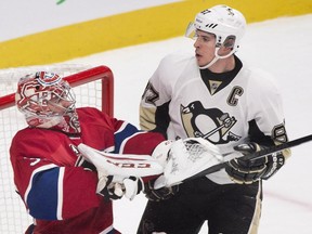 Pittsburgh Penguins' Sidney Crosby (87) moves in on Montreal Canadiens goaltender Carey Price during second period NHL hockey action in Montreal, Saturday, January 10, 2015.