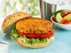 Fresh salmon seasoned with hot peppers makes a fine burger in a recipe from a new fish cookbook.