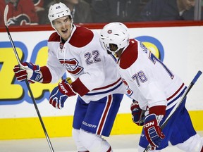 Montreal Canadiens' Dale Weise, left, celebrates his third goal with teammate P. K. Subban during third period NHL hockey action against the Calgary Flames in Calgary, Friday, Oct. 30, 2015.
