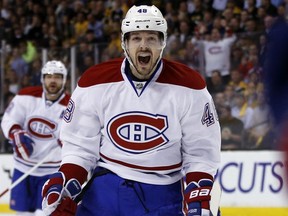 In this May 14, 2014, file photo, Montreal Canadiens centre Daniel Brière celebrates Dale Weise's goal against the Boston Bruins during the first period in Game 7 of an NHL hockey second-round playoff series in Boston.