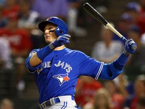 Troy Tulowitzki #2 of the Toronto Blue Jays hits a single in the eighth inning against Ross Ohlendorf #51 of the Texas Rangers during game three of the American League Division Series on Oct. 11, 2015, in Arlington, Texas.