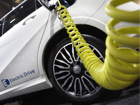 Picture taken on September 15, 2015 shows a Mercedes electric drive car plugged for charging during the second press day of the 66th IAA auto show in Frankfurt am Main, western Germany.