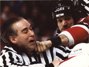 New Jersey Devils'  Mike Peluso bounces a punch off Canadiens' Lyle Odelein and nails linesmen Gerard Gauthier in the chin at the Forum on March 1, 1996.
