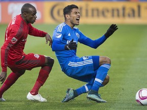 Montreal Impact's Johan Venegas, right, is challenged by Toronto FC's Jackson during first-half MLS soccer action in Montreal, Sunday, Oct. 25, 2015.