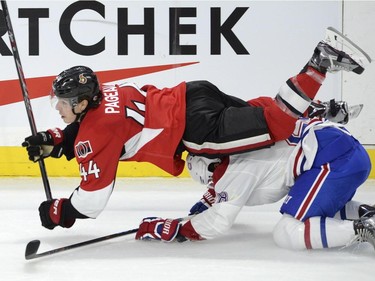 Ottawa Senators' Jean-Gabriel Pageau (44) collides with Montreal Canadiens' Alexander Semin (28) during the third period of a pre-season NHL hockey game, Saturday, October 3, 2015, in Ottawa.