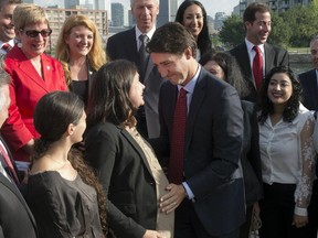 Federal Liberal leader Justin Trudeau greets pregnant candidate Christine Poirier at a morning event with Montreal-area candidates on Aug. 10.