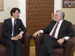 Quebec Liberal party Leader Philippe Couillard, right, meets federal Liberal Leader Justin Trudeau at the legislature in Quebec City, Thursday, April 18, 2013. A study of Couillard's performance as premier has found he's outdone his predecessors when it comes to keeping his election campaign promises. Meanwhile, a website has been set up to track how well Trudeau follows through on his campaign pledges  now that he's prime minister.