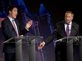 Liberal leader Justin Trudeau, left, debates NDP leader Tom Mulcair during the Globe and Mail leaders' debate Thursday, Sept. 17, 2015  in Calgary.