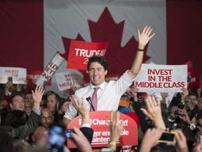 Liberal Leader Justin Trudeau waves to supporters as he takes the stage at a campaign rally in Winnipeg on Saturday, Oct. 17, 2015.