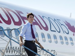 Liberal Leader Justin Trudeau steps off his campaign plane arriving in Fredericton, Wednesday, October 7, 2015.