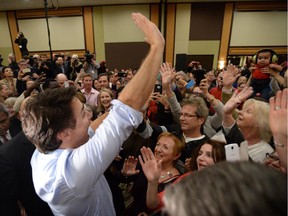 Prime Minister-designate Justin Trudeau waves to supporters at a welcome rally in Ottawa on Tuesday, Oct. 20, 2015.