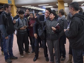Prime minister-designate Justin Trudeau greets and takes photos with constituents at Jarry métro station on Tuesday, October 20, 2015, the morning after winning a majority government in the federal election.