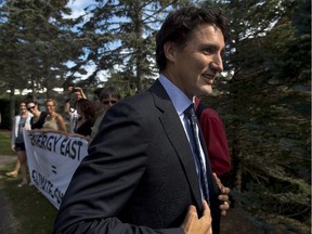 Liberal Leader Justin Trudeau arrives at a private fundraising event after chatting with anti-pipeline demonstrators in Chester, N.S. on Sunday, August 24, 2014.