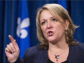 Quebec Public Security Minister Lise Thériault speaks Friday, October 23, 2015 at the legislature in Quebec City.