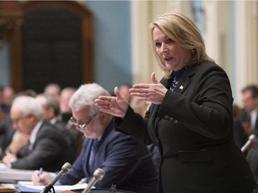 Quebec Public Security Minister Lise Thériault responds during question period Wednesday, October 28, 2015 at the legislature in Quebec City to Opposition questions over sexual assaults allegation by police officers. The Premier's Office said in a press release Thursday that Thériault will be taking a temporary leave.