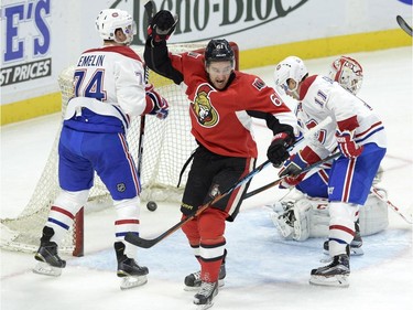Ottawa Senators' Mark Stone (61) celebrates a goal by teammate Chris Wideman (not shown) against the Montreal Canadiens during the first period of a pre-season NHL hockey game, Saturday, October 3, 2015, in Ottawa.