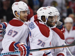 Canadiens' Max Pacioretty, P.K. Subban and Andrei Markov celebrate a goal by Markov during the second period against the Sabres on Friday Oct. 23, 2015, in Buffalo, N.Y.