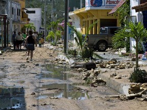 View of a street in Barra de Navidad, Jalisco state, partially destroyed after Hurricane Patricia hit the shore on Oct. 24, 2015. Record-breaking Hurricane Patricia weakened to a tropical storm over north-central Mexico on Saturday, dumping heavy rain that triggered flooding and landslides but so far causing less damage than feared.