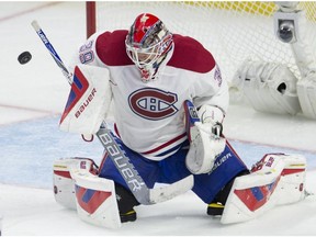 Montreal Canadiens goalie Mike Condon makes a save during second period NHL action against the Ottawa Senators Sunday, October 11, 2015, in Ottawa.