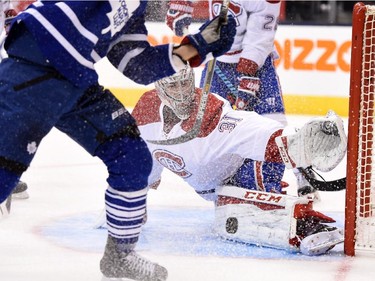 Montreal Canadiens goalie Carey Price makes a pad save against the Toronto Maple Leafs during second period NHL action in Toronto on Wednesday, Oct. 7, 2015.