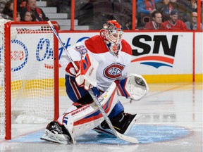 Goaltender Mike Condon of the Canadiens protects his net and wins his first NHL game against the Ottawa Senators at Canadian Tire Centre on Oct. 11, 2015, in Ottawa.