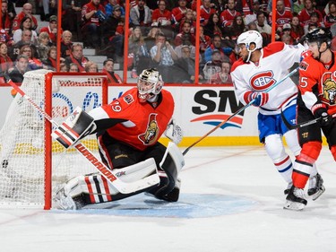 Goaltender Matt O'Connor #29 of the Ottawa Senators allows a goal on a shot by Torrey Mitchell #17 of the Montreal Canadiens (not pictured) during the NHL game at Canadian Tire Centre on October 11, 2015 in Ottawa.