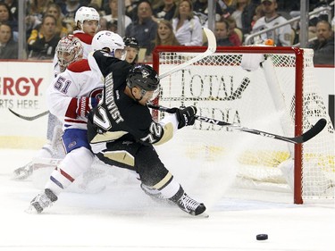 Patric Hornqvist (#72) of the Pittsburgh Penguins battles David Desharnais (#51) of the Montreal Canadiens in front of the net during the game at Consol Energy Center on October 13, 2015 in Pittsburgh, Pennsylvania.