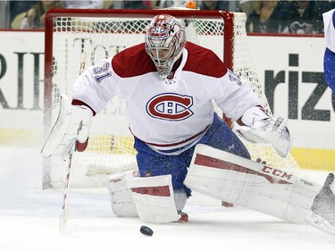 Carey Price (#31) of the Montreal Canadiens makes a save in the first period during the game against the Pittsburgh Penguins at Consol Energy Center on October 13, 2015 in Pittsburgh, Pennsylvania.