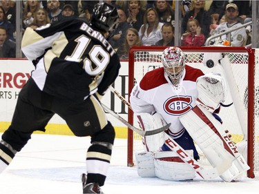 Beau Bennett (#19) of the Pittsburgh Penguins shoots the puck over Carey Price (#31) of the Montreal Canadiens during the game at Consol Energy Center on October 13, 2015 in Pittsburgh, Pennsylvania.