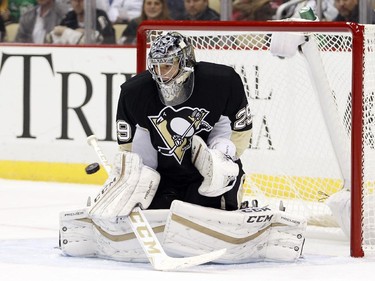 Marc-André Fleury (#29) of the Pittsburgh Penguins makes a save in the second period during the game against the Montreal Canadiens at Consol Energy Center on October 13, 2015 in Pittsburgh, Pennsylvania.