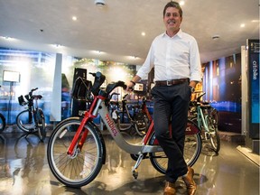 Luc Sabbatini, PBSC Urban Solutions' CEO, with one of his bikes, at PBSC Urban Solutions in Longueuil. The bike in the photo circulates in Guadalajara, Mexico.