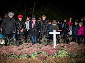 People gather at the vigil in Jenique Dalcourt's memory, on Wednesday October 21, 2015, in Longueuil. Jenique Dalcourt was beaten to death a year ago.