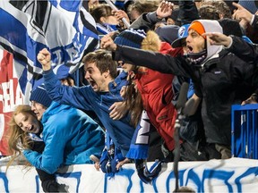 Impact fans celebrate after a goal during 3-0 win over Toronto FC in MLS playoff game at Montreal's Saputo Stadium on Oct. 29, 2015.