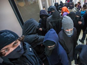 Masked student protesters participating in a student strike at UQAM this past April.