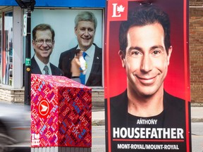 A large federal election campaign sign for Liberal candidate Anthony Housefather is seen across the street from the headquarters for Conservative candidate Robert Libman, at Décarie Blvd. and Vézina St., in August.