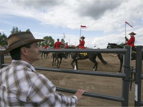 St-Lazare Mayor Robert Grimaudo watches the RCMP Musical Ride at the St-Lazare Au Galop, Saturday, August 8, 2015. (Robert Amyot / MONTREAL GAZETTE)