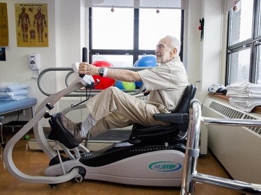 MONTREAL, QUE.: DECEMBER 18, 2013 -- Eighty-six year-old Albert Spiegel demonstrates the exercise for the physical therapy of his left leg at the Institut de réadaptation Gingras-Lindsay-de-Montréal in Montreal on Wednesday, December 18, 2013. Spiegel suffered a heart attack while taking his dog to be put down and was given an emergency dose of medication which left his left leg paralyzed. (Dario Ayala / THE GAZETTE) ORG XMIT: 48815