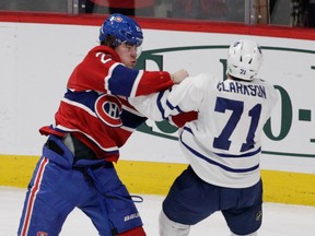 Nathan Beaulieu of the Canadiens fights David Clarkson of the Toronto Maple Leafs at the Bell Centre on Feb. 14, 2015.