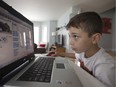 Eight-year-old Julian Sarli, at home in St-Laurent, has ADHD and learning disabilities. He has benefitted from Cedarcrest Elementary's coding program for students with special needs.