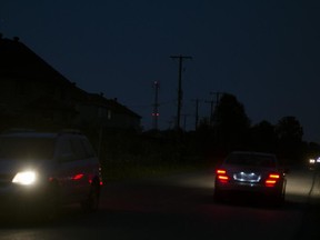 MONTREAL, QUE.: JULY 6, 2015 --  There are no streetlights on a stretch of Pierrefonds Blvd. in Pierrefonds, west of Chateau Pierrefonds, Monday, July 6, 2015. Homes have been there for 15 years, but the borough is not allowed to install street lamps because the area is reserved to be used as the future Highway 440 extension, for which plans have been abandoned, and the province continues to retain the land.  (Peter McCabe / MONTREAL GAZETTE)
