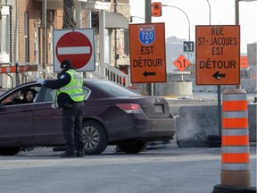Most city and provincial officials should be embarrassed at how they’ve handled N.D.G's construction mess over the past five years. A police officer directs a woman at the corner of  Girouard Ave. and St-Jacques St.