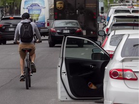 Riding in the opposite direction of traffic would decrease the risk of dooring on city streets, an expert says.