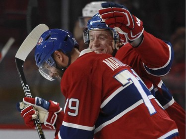 Montreal Canadiens Alex Semin, rear congratulates teammate Andrei Markov for his first-period goal against the Ottawa Senators during a National Hockey League pre-season game in Montreal Thursday October 1, 2015.